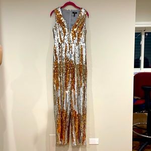 Brand new jump suit! Great condition, let yourself be the star of the show!